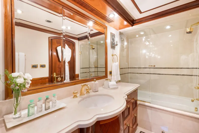 Slide: The Image of Luxurious yacht bathroom with elegant wood accents and marble countertop, Richmond Yachts 2004 model. - 21