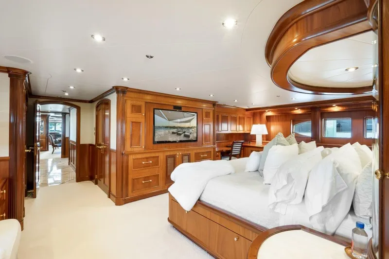 Slide: The Image of Luxurious Richmond Yachts 2004 interior with elegant wood paneling and plush bedding. - 13