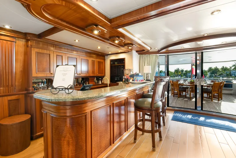 Slide: The Image of Luxurious Richmond Yachts 2004 interior with elegant wooden bar and dining area. - 26