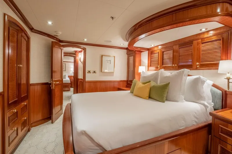 Slide: The Image of Luxurious Richmond Yachts 2004 bedroom with elegant wood paneling and plush bedding. - 17
