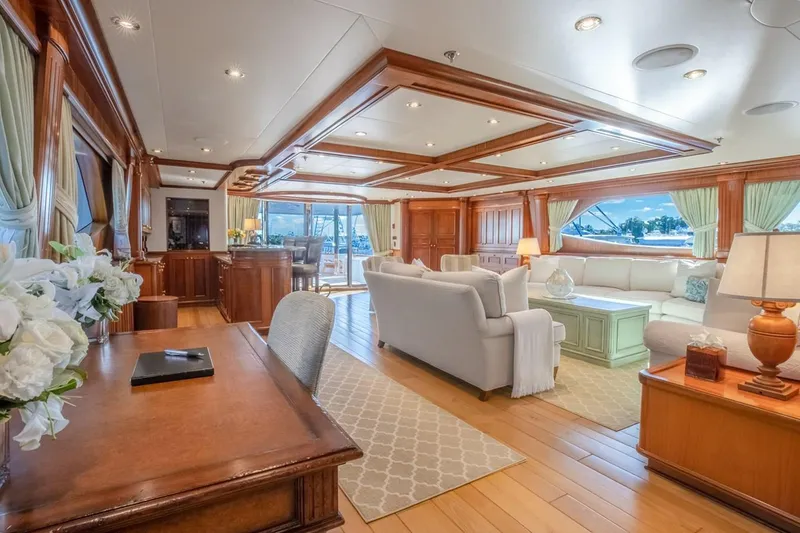 Slide: The Image of Luxurious interior of 2004 Richmond Yachts Semi-Displacement, featuring elegant woodwork and plush seating. - 27