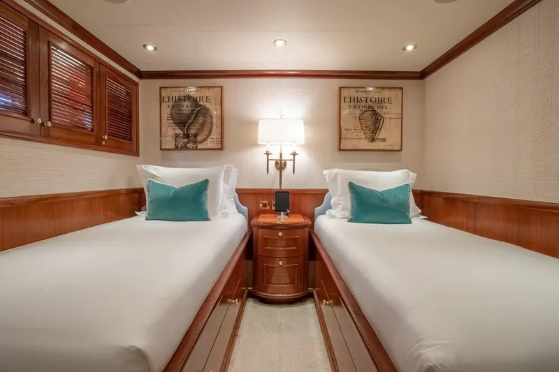 Slide: The Image of Luxurious twin cabin on 2004 Richmond Yachts Semi-Displacement, featuring elegant wood finishes. - 20