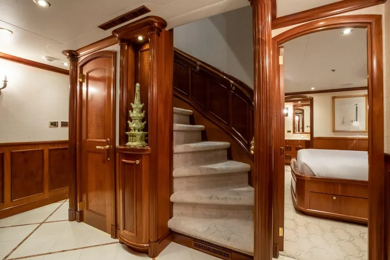 Slide: The Image of Luxurious Richmond Yachts 2004 interior with elegant wood paneling and plush carpeted staircase. - 16