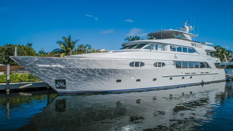 Slide: The Image of Richmond Yachts 2004 semi-displacement yacht docked, reflecting on calm water. - 37