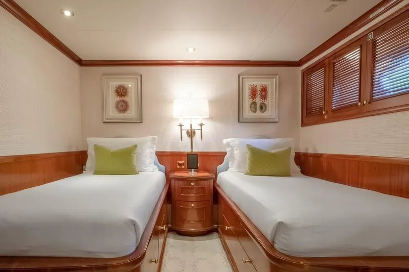 Slide: The Image of Luxurious twin cabin on 2004 Richmond Yachts Semi-Displacement, elegant wood finish, cozy ambiance. - 19