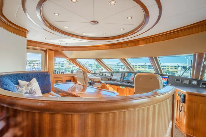 Slide: The Image of Luxurious Richmond Yachts 2004 semi-displacement helm with panoramic windows and elegant wood finish. - 33