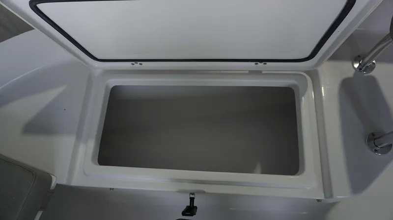 Slide: The Image of Open storage compartment on 2024 Sportsman 212 Open boat. - 10