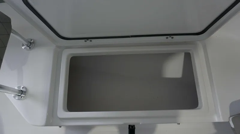 Slide: The Image of Open storage compartment of 2024 Sportsman 212 Open boat. - 11