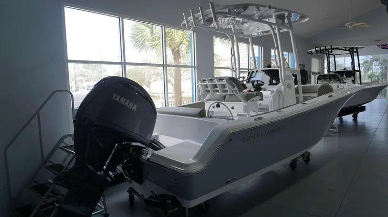 Slide: The Image of 2024 Sportsman 212 Open boat with Yamaha outboard motor in showroom. - 3