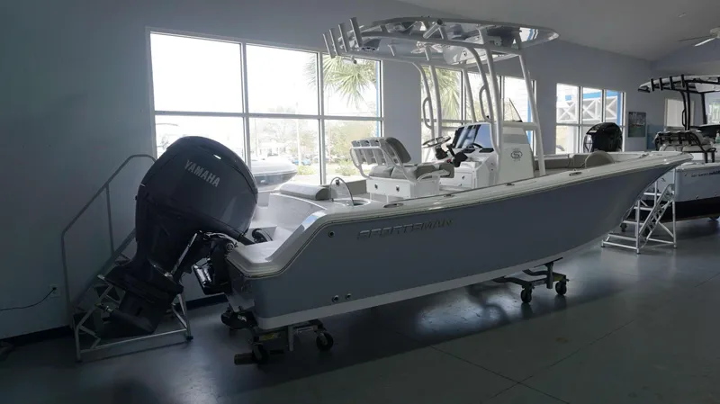 Slide: The Image of 2024 Sportsman 212 Open boat with Yamaha outboard motor in showroom. - 5