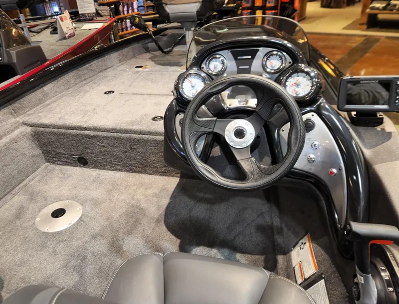 Slide: The Image of 2024 Tracker Pro Team 175 TF boat interior with steering wheel and dashboard. - 2