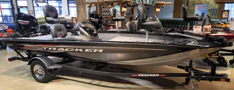 Slide: The Image of 2024 Tracker Pro Team 175 TF fishing boat on display indoors. - 3