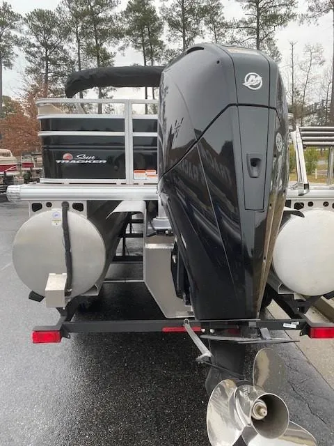 Slide: The Image of 2024 Sun Tracker Sportfish 24 XP3 pontoon boat with powerful outboard motor. - 3