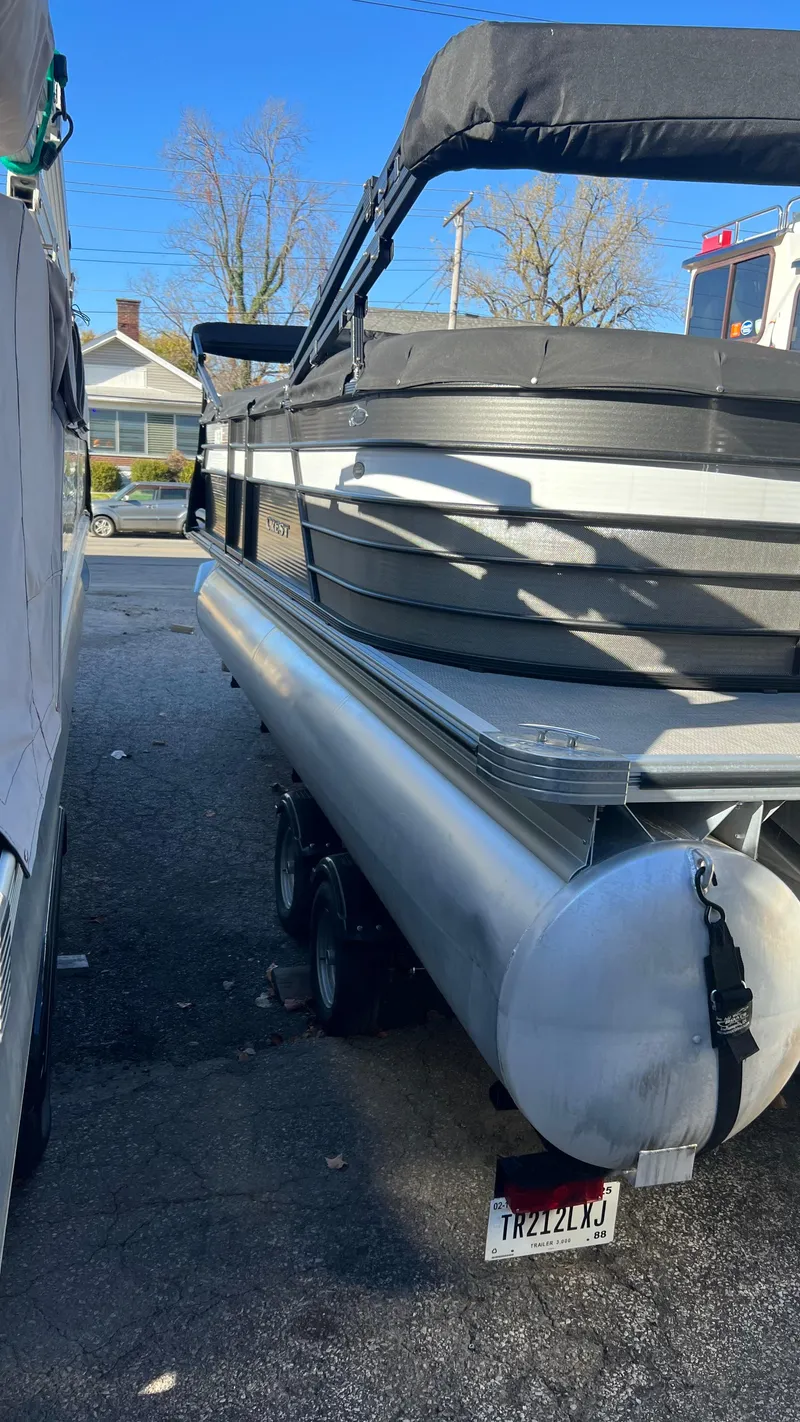 Slide: The Image of 2020 Crest Classic Platinum 220 SLC pontoon boat on trailer. - 2