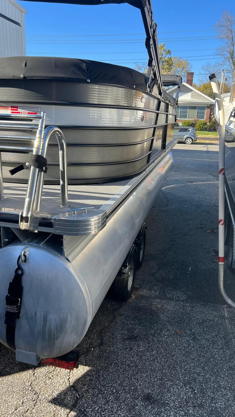Slide: The Image of 2020 Crest Classic Platinum 220 SLC pontoon boat on trailer, rear view. - 21
