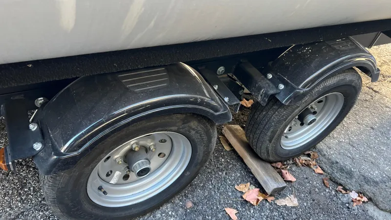Slide: The Image of Close-up of 2020 Crest Classic Platinum 220 SLC trailer wheels and fenders. - 24