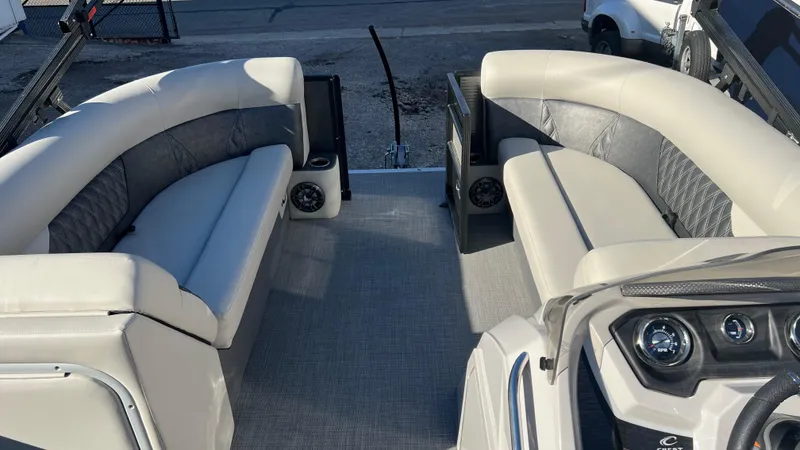 Slide: The Image of 2020 Crest Classic Platinum 220 SLC boat interior with plush seating and modern dashboard. - 4