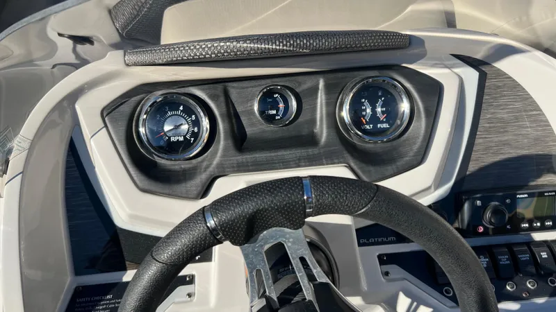 Slide: The Image of Dashboard of a 2020 Crest Classic Platinum 220 SLC boat with gauges and controls. - 5