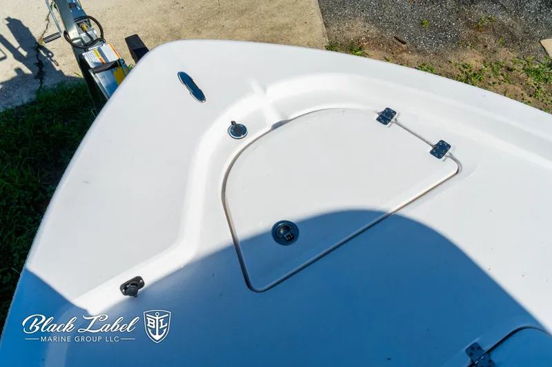 Slide: The Image of 2024 Sea Fox 231 Bay Fox Center Console boat deck with storage compartment. - 10