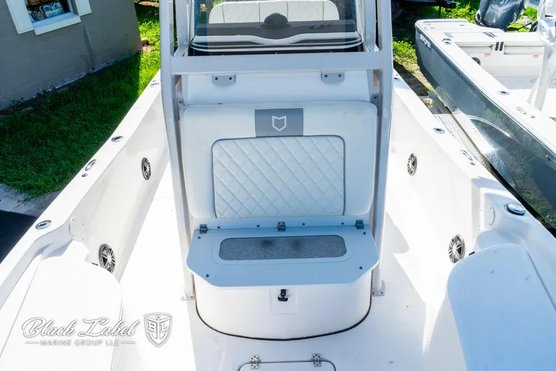 Slide: The Image of 2024 Sea Fox 231 Bay Fox Center Console interior with seating and storage. - 11