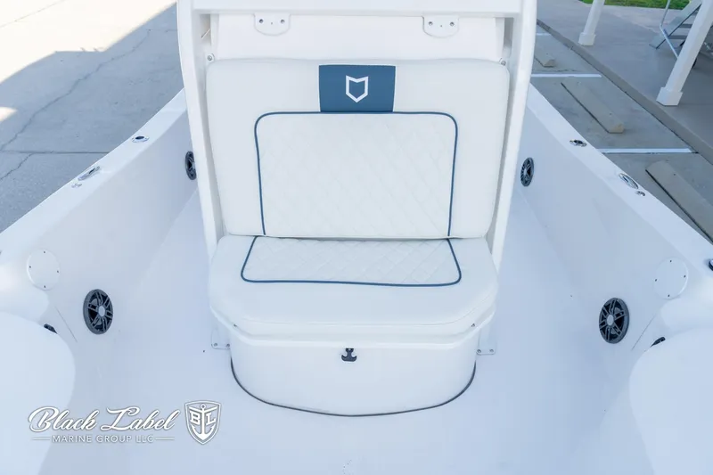 Slide: The Image of 2024 Sea Fox 251 BayFox Center Console boat seating area with white upholstery. - 14