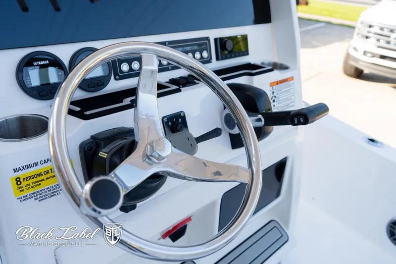 Slide: The Image of 2024 Sea Fox 251 BayFox Center Console steering wheel and dashboard controls. - 18