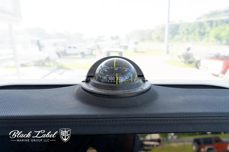 Slide: The Image of Compass on 2024 Sea Fox 251 BayFox Center Console dashboard, Black Label Marine Group. - 21