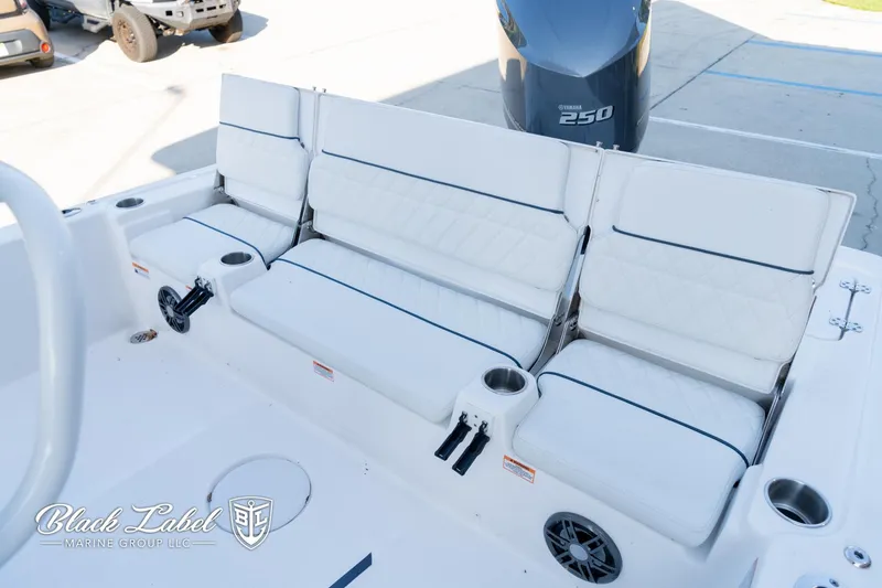 Slide: The Image of 2024 Sea Fox 251 BayFox Center Console with white cushioned seating and Yamaha 250 engine. - 25