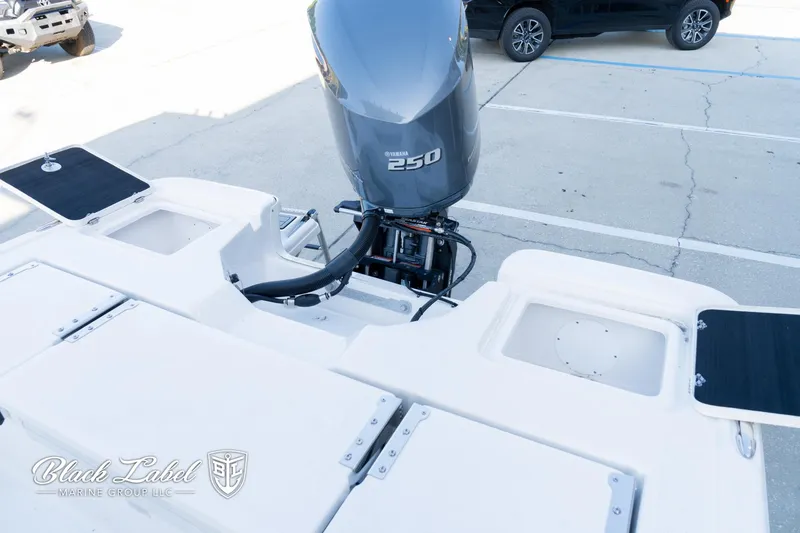 Slide: The Image of 2024 Sea Fox 251 BayFox Center Console with Yamaha 250 engine in parking lot. - 28