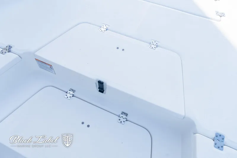 Slide: The Image of 2024 Sea Fox 251 BayFox Center Console boat storage compartment with secure latches. - 8