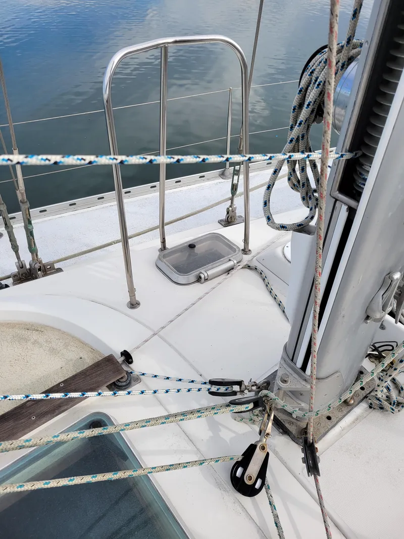 Slide: The Image of Deck of 1994 Jeanneau Sun Odyssey 51 sailboat with rigging and ropes. - 10