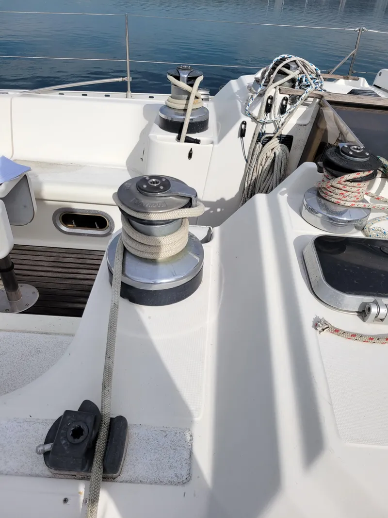Slide: The Image of Deck view of a 1994 Jeanneau Sun Odyssey 51 sailboat with winches and ropes. - 14