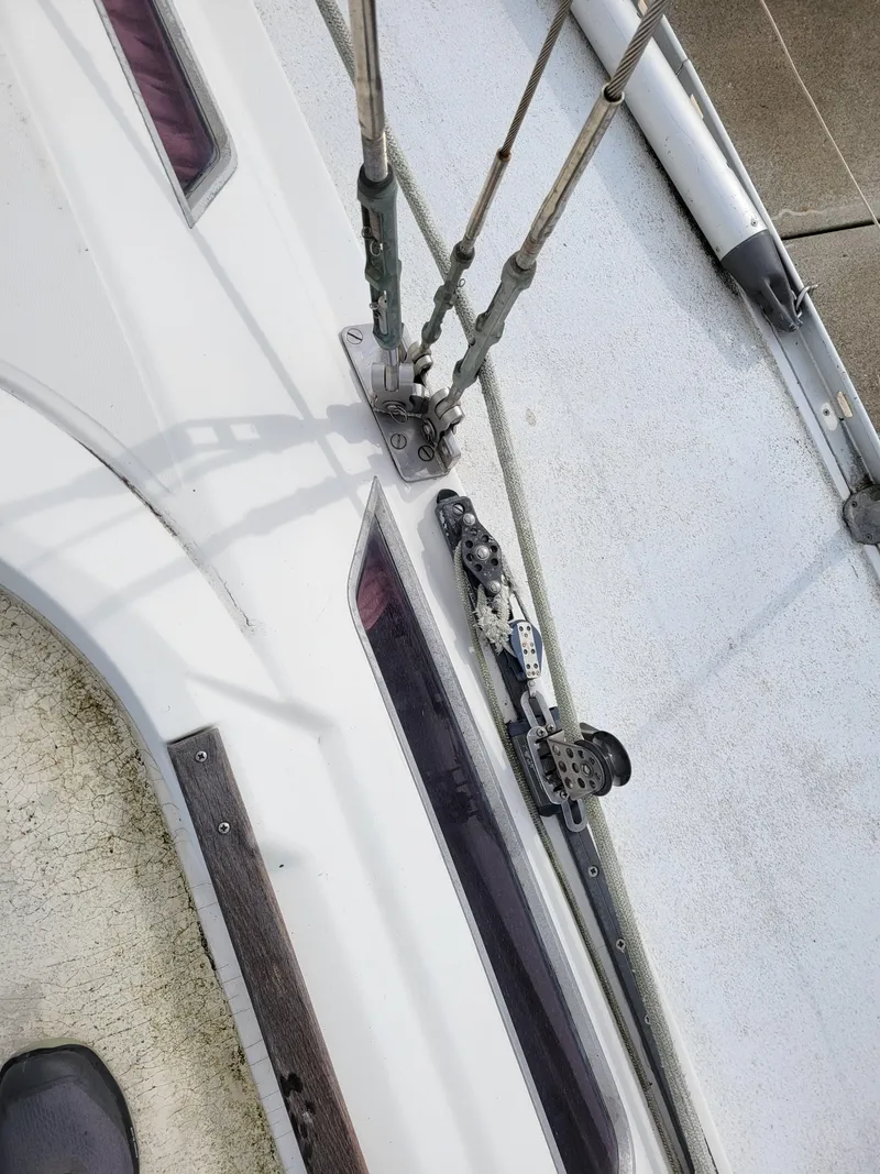 Slide: The Image of Deck view of a 1994 Jeanneau Sun Odyssey 51 sailboat, showing rigging and fittings. - 8