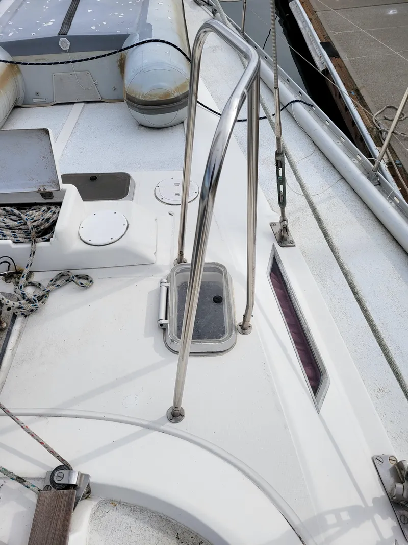 Slide: The Image of Deck of 1994 Jeanneau Sun Odyssey 51 sailboat with stainless steel railings. - 9