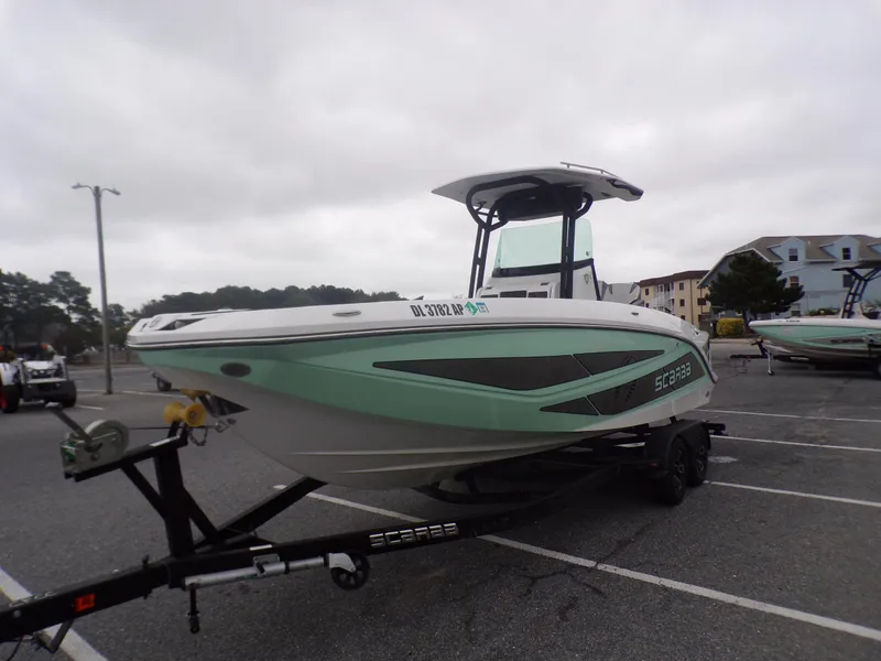 Slide: The Image of 2023 Scarab 255 Open ID boat on trailer in parking lot. - 3