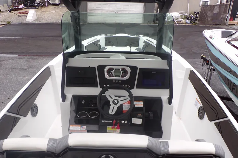 Slide: The Image of 2023 Scarab 255 Open ID boat dashboard and steering wheel. - 6