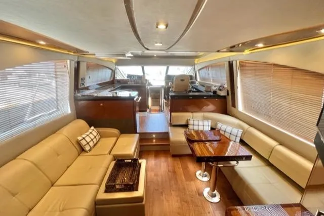 Slide: The Image of Luxurious interior of 2016 Sea Ray 510 Fly yacht with leather seating and wooden accents. - 46