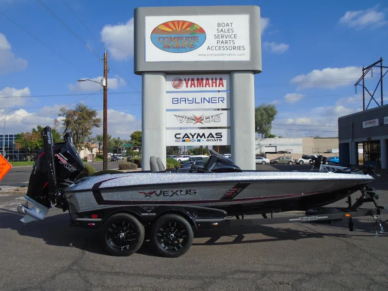 Slide: The Image of 2024 Vexus VX20 boat displayed at dealership with Yamaha, Bayliner, and Caymas signage. - 26