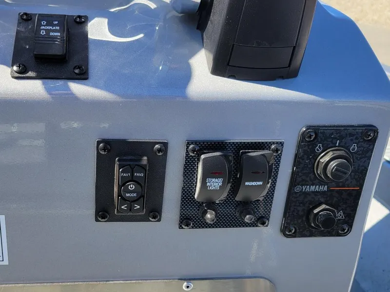 Slide: The Image of Control panel of 2024 Xpress H24 Bay boat with Yamaha engine controls. - 10