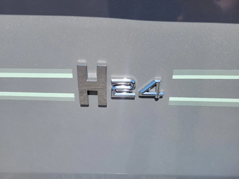 Slide: The Image of 2024 Xpress H24 Bay boat model emblem. - 4