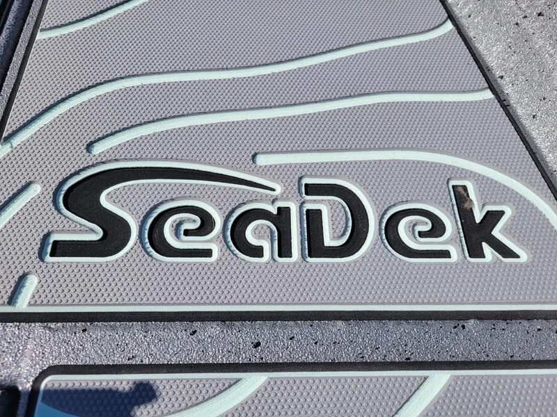 Slide: The Image of SeaDek logo on 2024 Xpress H24 Bay boat deck. - 6