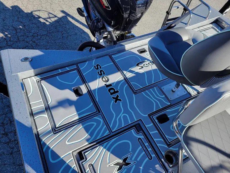 Slide: The Image of 2024 Xpress X23 Bay Lounge boat interior with stylish seating and modern design. - 11