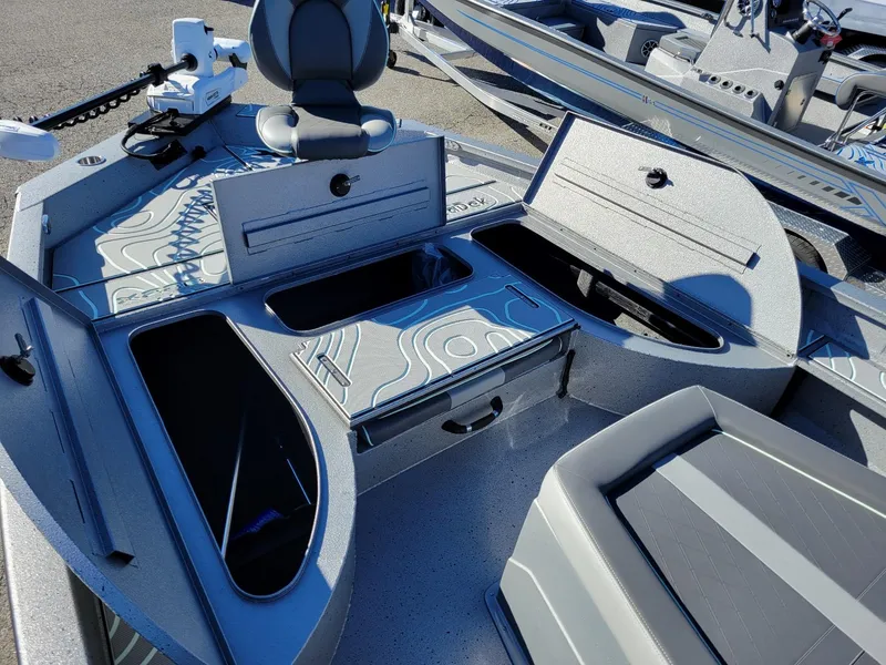 Slide: The Image of 2024 Xpress X23 Bay Lounge boat interior with storage compartments and seating. - 20
