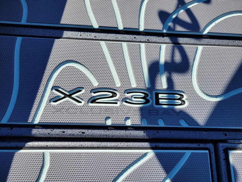Slide: The Image of 2024 Xpress X23 Bay Lounge boat deck with embossed design. - 4