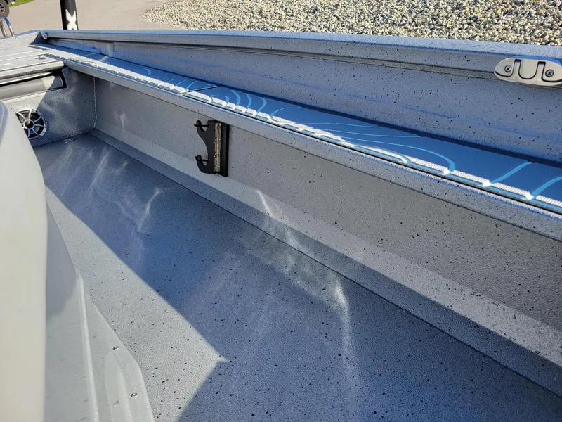 Slide: The Image of 2024 Xpress X23 Bay Lounge interior detail with blue accents and speaker. - 7