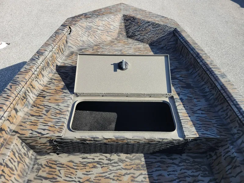 Slide: The Image of 2024 Xpress HD15DBX duck hunting boat with camo design and storage compartment. - 11