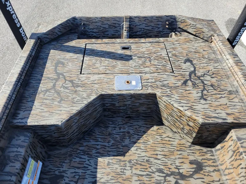 Slide: The Image of 2024 Xpress HD15DBX duck hunting boat with camouflage interior design. - 12