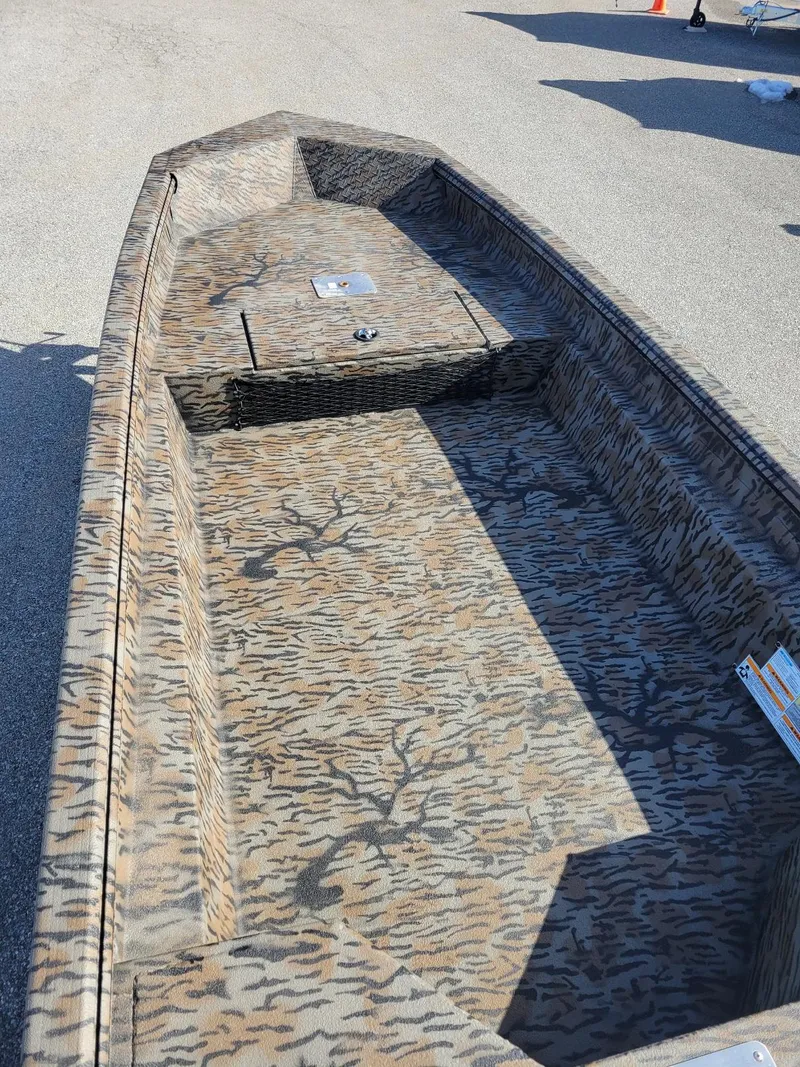 Slide: The Image of 2024 Xpress HD15DBX duck hunting boat with camouflage interior, in stock. - 6