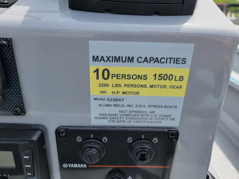 Slide: The Image of 2024 Xpress X23 Bay Lounge capacity label, 10 persons, 1500 lbs, dual Yamaha 150s. - 17