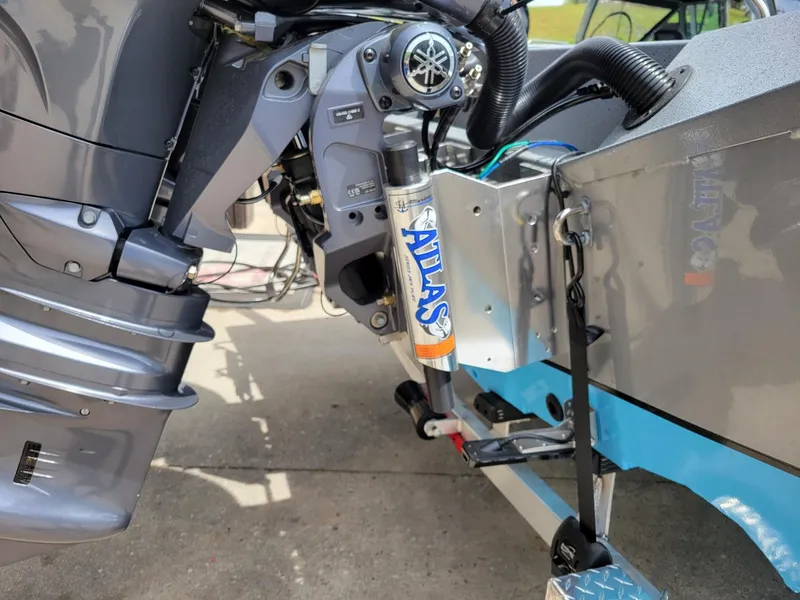 Slide: The Image of Close-up of 2024 Xpress X23 Bay Lounge dual Yamaha 150's outboard motor. - 3